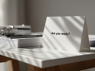 Motivational message on a desk with stationery in soft sunlight during a quiet afternoon