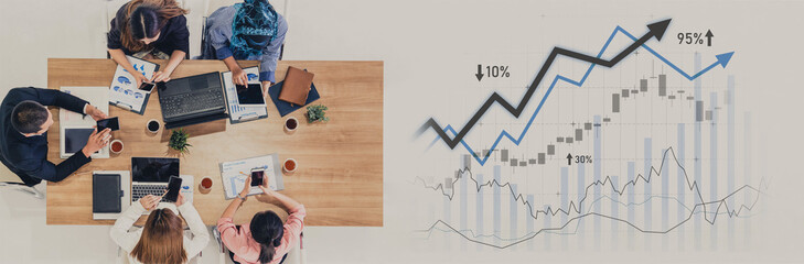 A diverse business team engages in a collaborative meeting to discuss financial growth strategies, analyzing charts and graphs in a modern office environment. Scalp