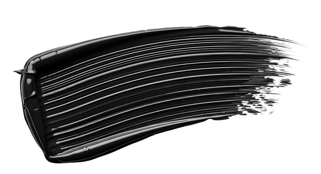 Black mascara smudge swatch texture on black background showing fine bristle lines