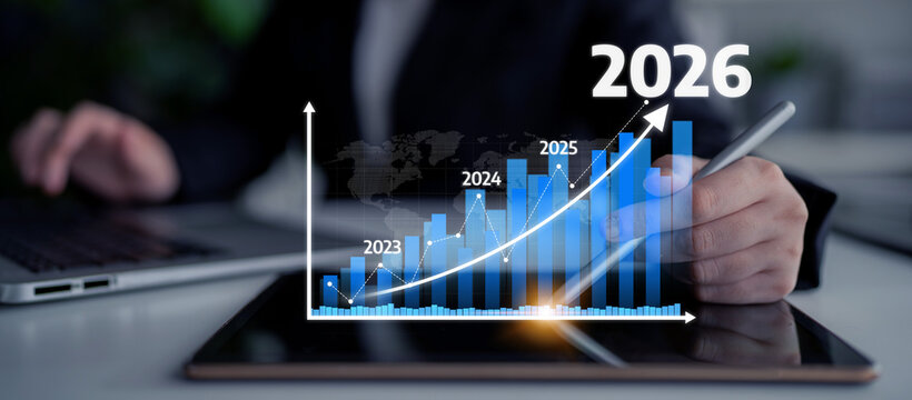 A business professional analyzes data trends on a tablet, showcasing a digital graph projecting growth from 2023 to 2026, symbolizing future success. Tessel