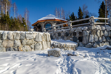 Winter landscape with pavilion