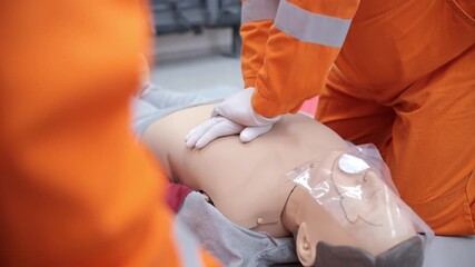 CPR chest compressions on training mannequin