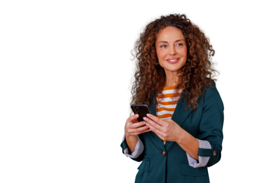 Professional woman with curly hair holding smartphone, smiling, interacting with mobile technology, using app