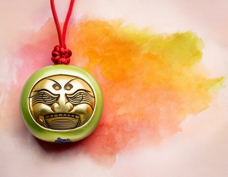 close up of traditional japanese omamori charm on watercolor background with ample copy space for cultural themed designs