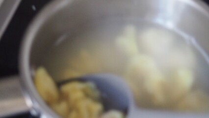 Tortellini with parmesan, ready to eat, Italian ravioli pasta with spinach and ricotta on white table, traditional italian food with herbs and vegetables