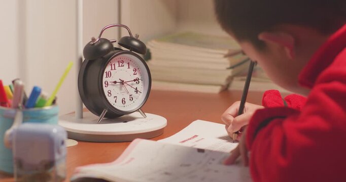 The children are doing their homework very late.