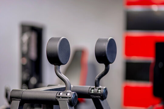 A close up of a bike handlebar in a gym
