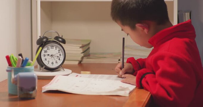 The children are doing their homework very late.
