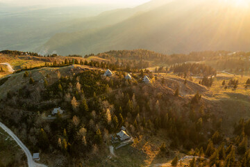 Mountain village in Alps, wooden houses at sunset, Velika Planina, Kamnik, Slovenia