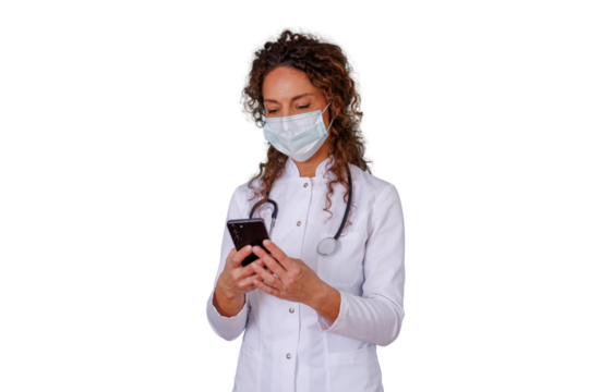 Doctor wearing mask and stethoscope looking at smartphone, providing telehealth consultation on transparent background - Powered by Adobe