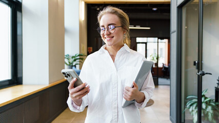 Young professional enjoys her workday at the office