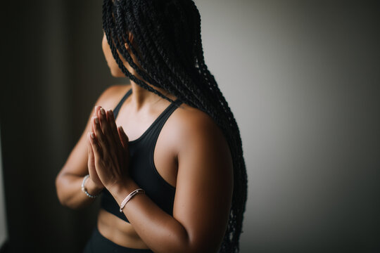 Person practicing mindfulness near window