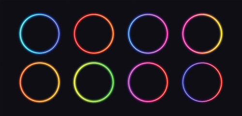 Collection of eight vibrant glowing neon oval frames in various bright colors on a dark background © PixelOriel
