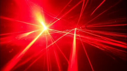 Dynamic red laser light beams create a futuristic abstract background with intersecting rays in a dark space, perfect for technology, party, and entertainment visuals.