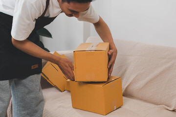 Close-up of man holding a parcel box, representing delivery service, shipping, e-commerce...