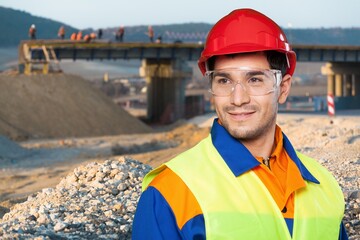 Portrait worker adult engineer in quarry for mining survey