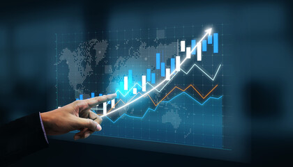 A businessman points at a digital financial graph showcasing growth trends and investment opportunities, with a global map in the background, emphasizing analysis and strategy. Impute