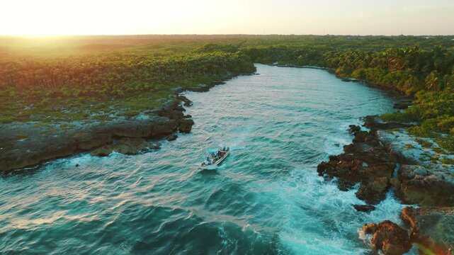 Boat navigating through turquoise tropical river between lush palm forests