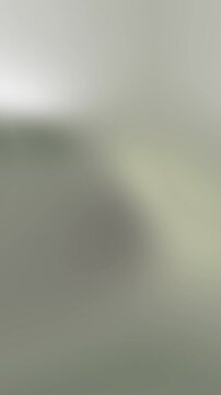 Black linear gradientbackground with a soft and smooth gradient of muted gray and pale green tones, ideal for web design or wallpaper
