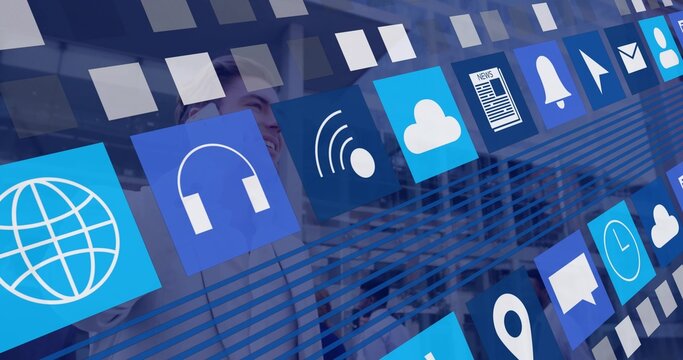 Displaying blue app tiles across corporate meeting room glass, revealing team in business attire