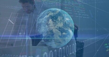 Floating holographic Earth globe superimposing over modern office workspace, with financial charts