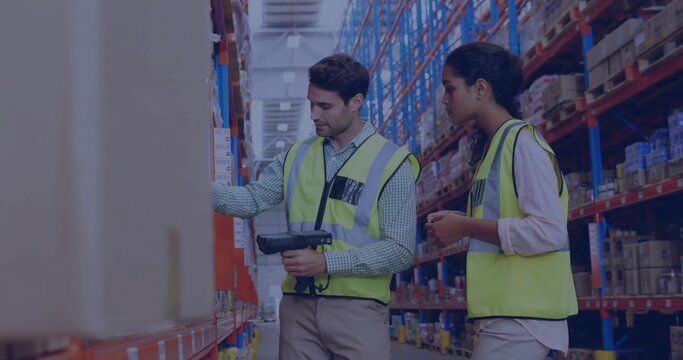 Scanning two warehouse workers checking shelves in aisle, with handheld scanner and high-vis vests