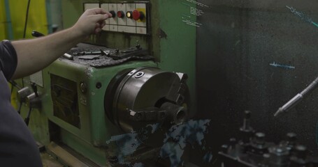 Reaching machinist in dark shirt pressing panel button on lathe in workshop with chuck, copy space