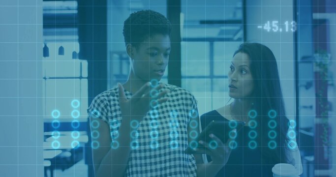 Discussing women in checkered blouse, dark top, gesturing in office with phone, cup, data overlay