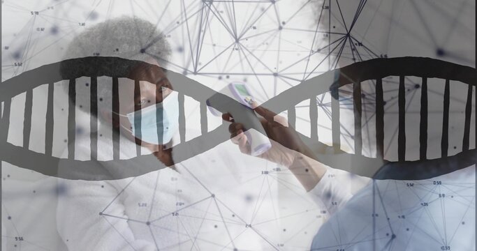 Checking clinician in scrubs, masks scanning patient at clinic with IR gun and DNA overlay