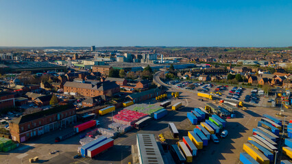 Aerial panorama showing logistics yard and distant city