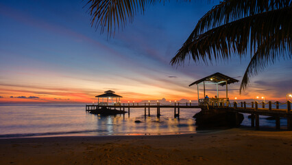 Beautiful sunset over the peaceful pier on Koh Kood Island Thailand