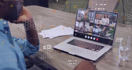 Man resting chin using trackpad as remote team speaking, data overlaying laptop docs for meeting - Powered by Adobe