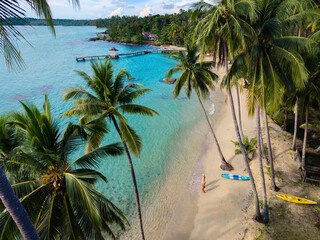 Stunning tropical beach scenery at Koh Kood Island with kayaks lining the shore