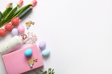 Composition with sports equipment, Easter eggs, decor and flowers on light background