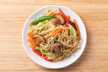 Vegetarian stir fried noodles with mushroom and vegetables with soy sauce, Asian food style
