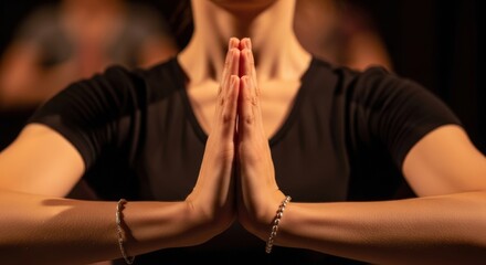 Close-up of person's hands in prayer position, hands together, focus on gesture