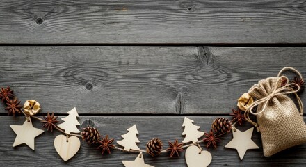 Rustic christmas decorations with pinecones, stars, and burlap sack on wooden background