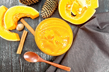 Pumpkin puree in jar on board top