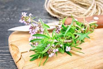 Thyme  fresh with twine on board
