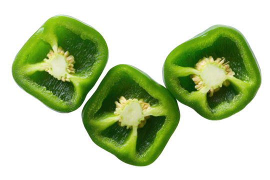 Three sliced green bell peppers, showing inner structure