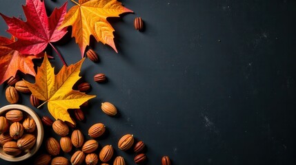 Autumnal Composition Featuring Colorful Maple Leaves and a Collection of Nuts Arranged on a Dark Surface