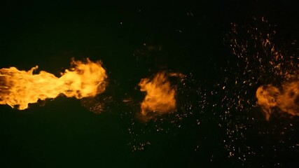 A dynamic display of flames bursts from left to right against a dark backdrop