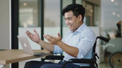 Disabled Asian professional having an enthusiastic video call in a modern office - Powered by Adobe