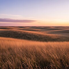Naklejka premium Golden Hour Sunset Over Rolling Prairie Hills and Grassy Fields.