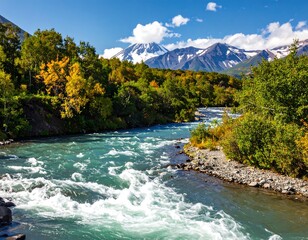 A vibrant scenic shot of a river flowing through lush greenery, with snow-capped mountains and a clear blue sky in the background