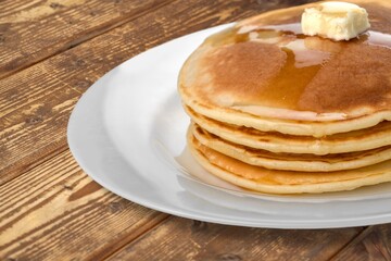 Crepes, tasty pancakes on plate with berries