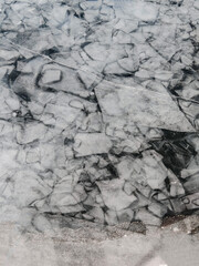 Endless hummock field on frozen Lake Baikal. Piles of snow-covered debris of blue ice on frosty day
