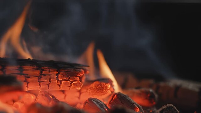 Wood Burning With Flames and Smoke in Fireplace, Close Up
