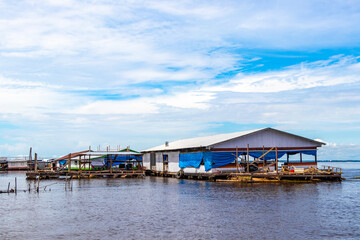 Village huts houses on stilts in the water Amazonas Brazil.