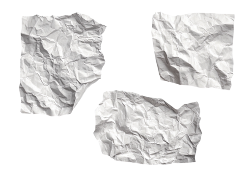 Three crumpled white paper pieces on a dark background